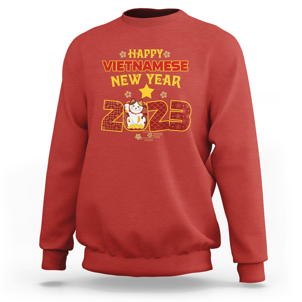 Red crewneck sweatshirt with 'Happy Vietnamese New Year 2023' graphic on chest.
