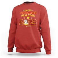Red crewneck sweatshirt with 'Happy Vietnamese New Year 2023' graphic on chest.