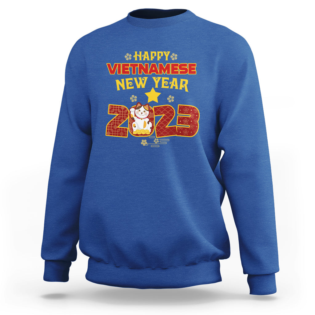 Royal blue crewneck sweatshirt with 'Happy Vietnamese New Year 2023' graphic on chest.