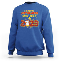 Royal blue crewneck sweatshirt with 'Happy Vietnamese New Year 2023' graphic on chest.