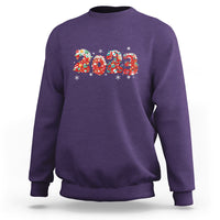 Purple crewneck sweatshirt with colorful 2023 graphic and festive snowflake accents
