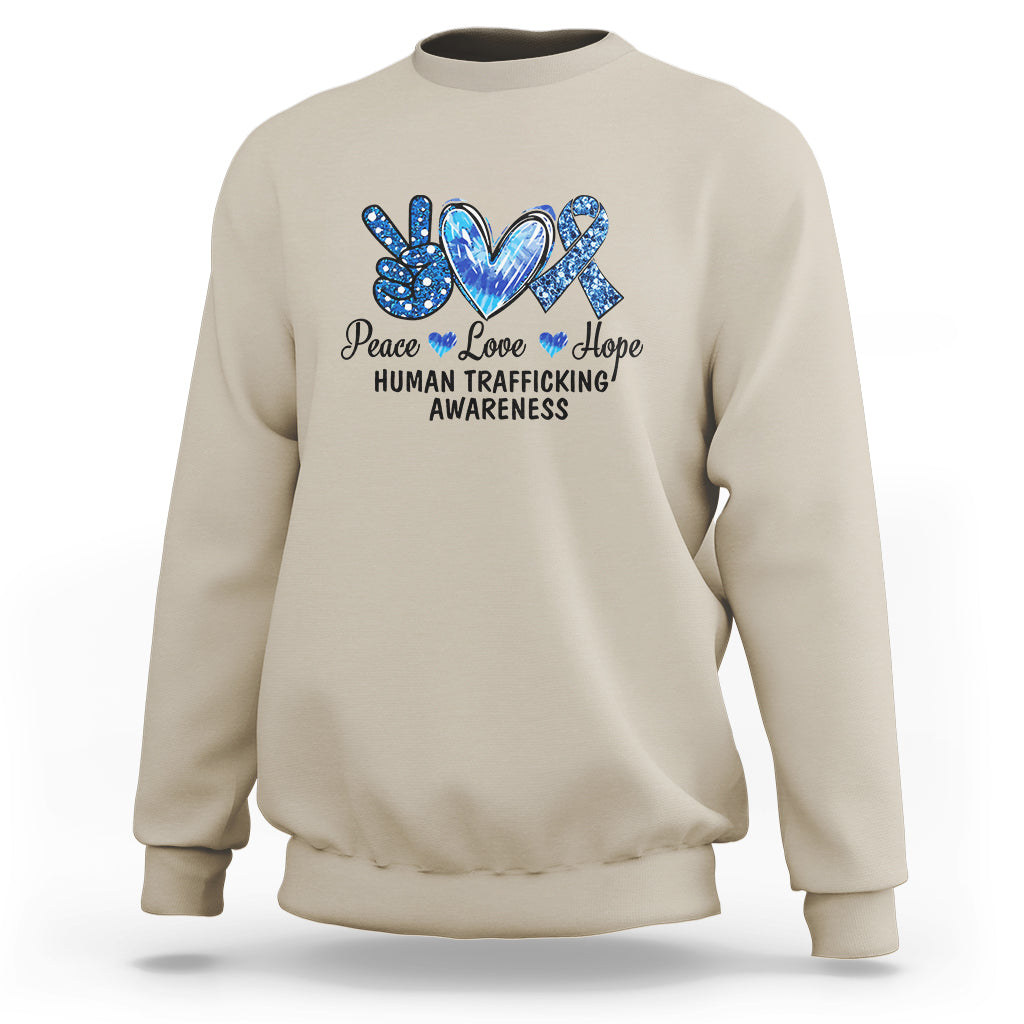 Human trafficking awareness sweatshirt in sand with Peace Love Hope heart graphic