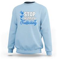 Light blue sweatshirt with blue ribbon graphic and “STOP HUMAN Trafficking” text on front