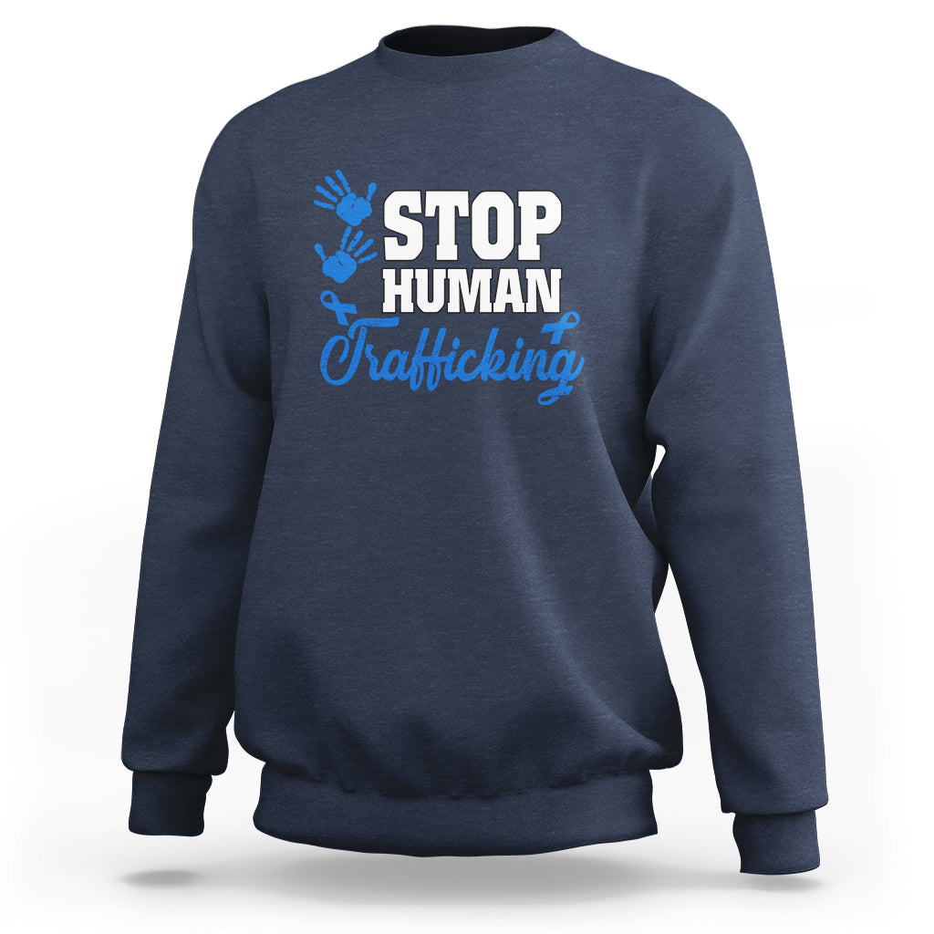 Navy sweatshirt with blue ribbon graphic and “STOP HUMAN Trafficking” text on front