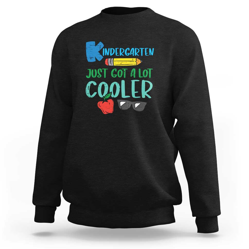 Kids black sweatshirt with colorful “Kindergarten…Cooler” graphic text on chest