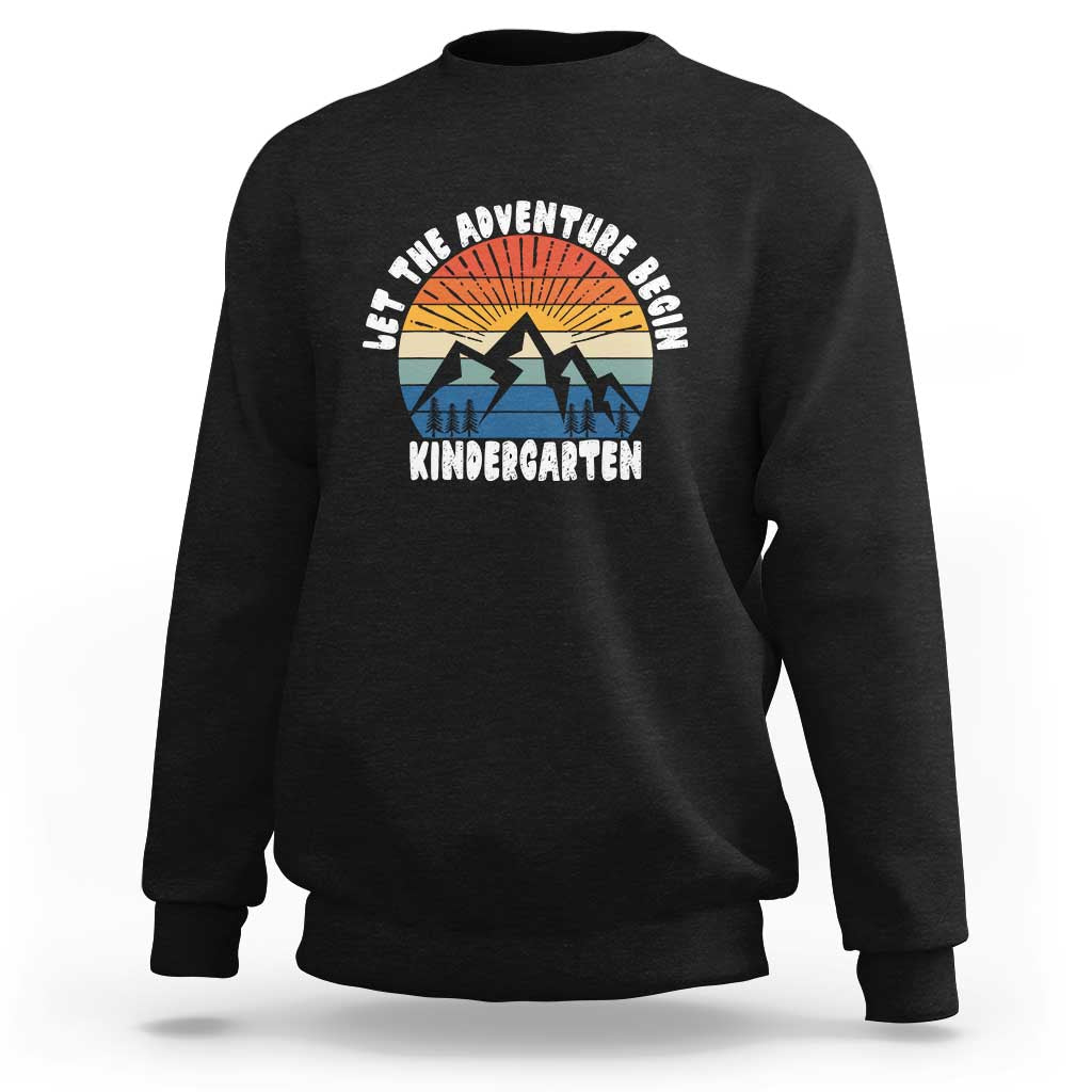 Black kindergarten sweatshirt with 'Let the adventure begin' logo and mountain sunrise graphic