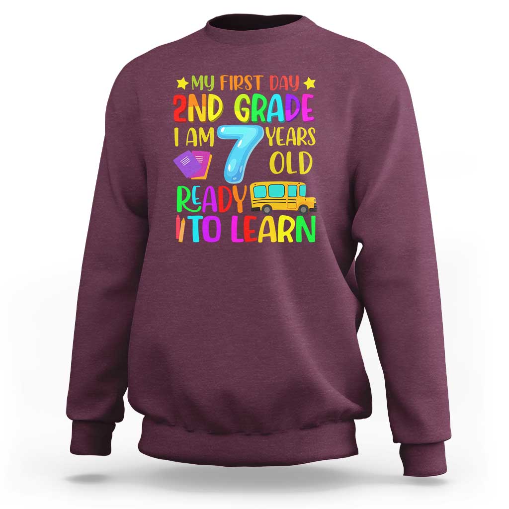 Maroon crewneck sweatshirt with colorful "My First Day 2nd Grade" graphic