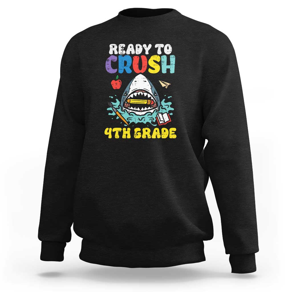 Black crewneck sweatshirt with colorful shark graphic and long sleeves.