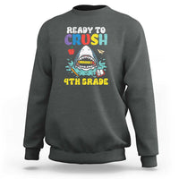 Dark heather crewneck sweatshirt with colorful shark graphic and long sleeves.