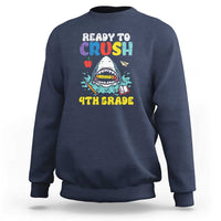 Navy crewneck sweatshirt with colorful shark graphic and long sleeves.