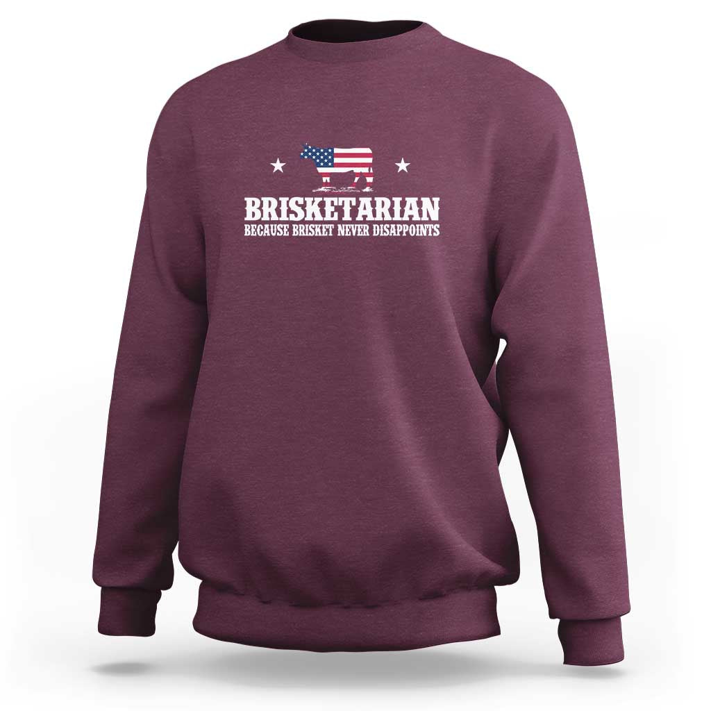 Maroon crewneck sweatshirt with chest “BRISKETARIAN” graphic and small American flag