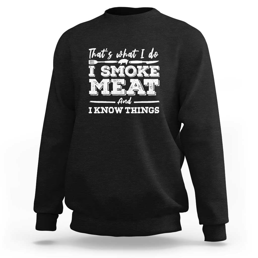 Black crewneck sweatshirt with "I SMOKE MEAT" printed graphic on back