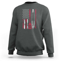 Dark heather crewneck sweatshirt, back graphic of BBQ smoker tools and stars flag