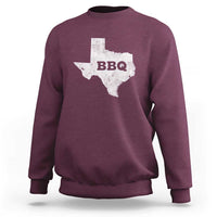 Maroon crewneck sweatshirt with Texas BBQ state graphic on back