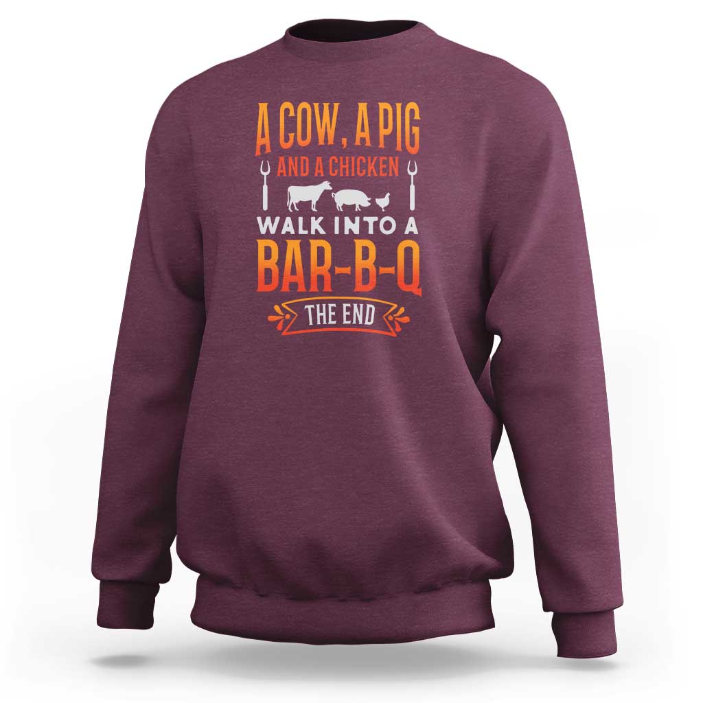 Maroon crewneck sweatshirt with cow-and-pig BBQ joke graphic on back