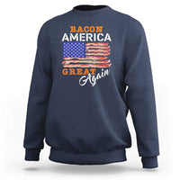 Navy crewneck sweatshirt with front “Bacon America Great Again” graphic and flag stripes.