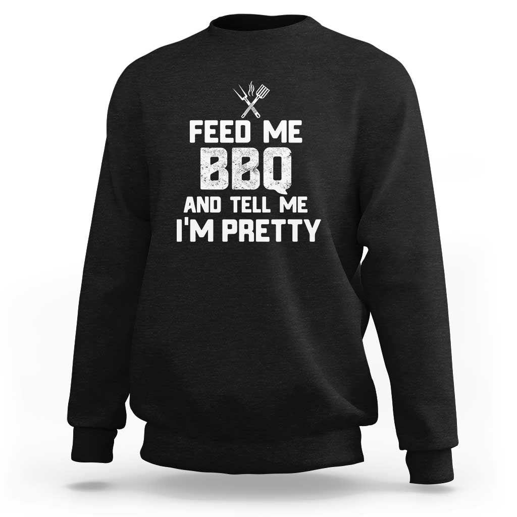 Black crewneck sweatshirt with “Feed Me BBQ and Tell Me I’m Pretty” grill graphic