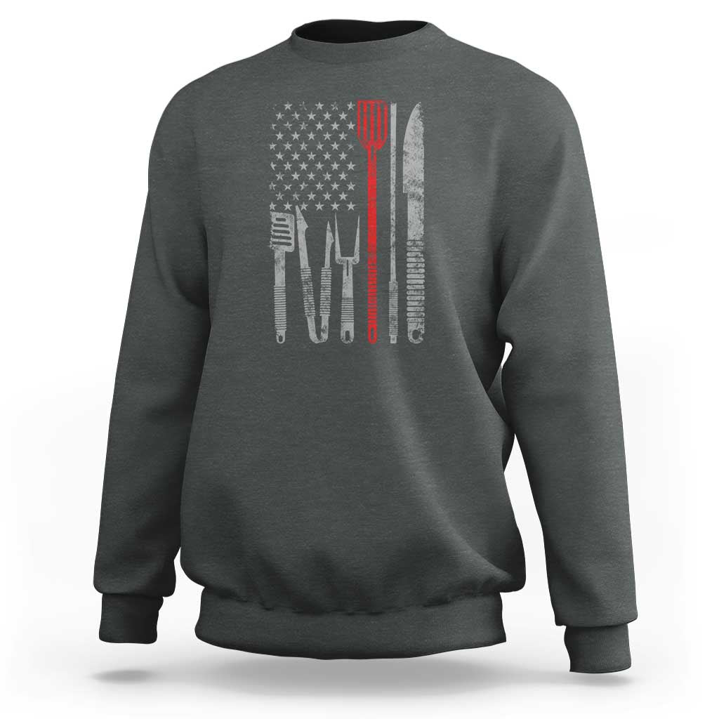 Charcoal sweatshirt with American flag graphic and chef utensils printed on back