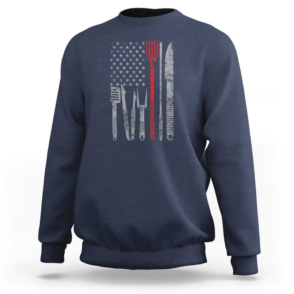 Navy sweatshirt with American flag graphic and chef utensils printed on back