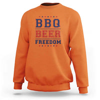 Orange crewneck sweatshirt with "BBQ BEER FREEDOM" patriotic graphic