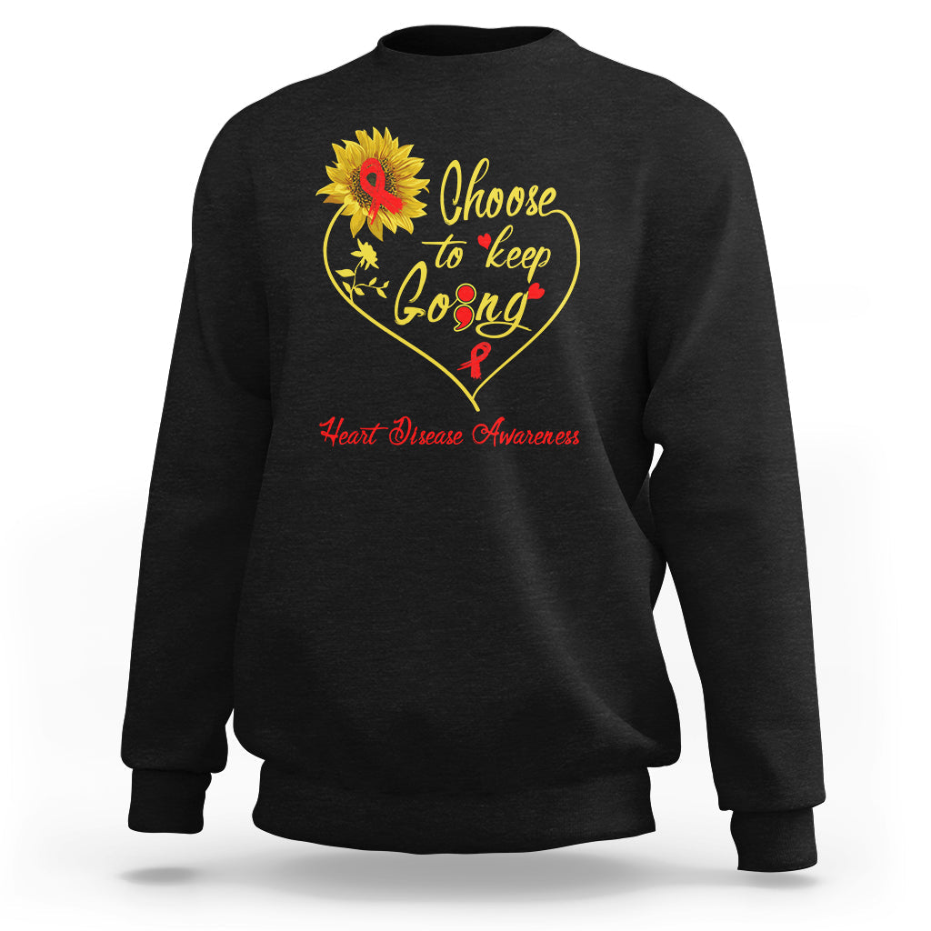 Black sweatshirt with “Choose to keep Going” heart graphic and heart disease awareness text
