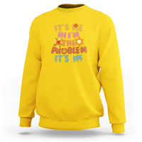 Yellow sweatshirt with floral "It's me I'm the problem It's me" quote graphic