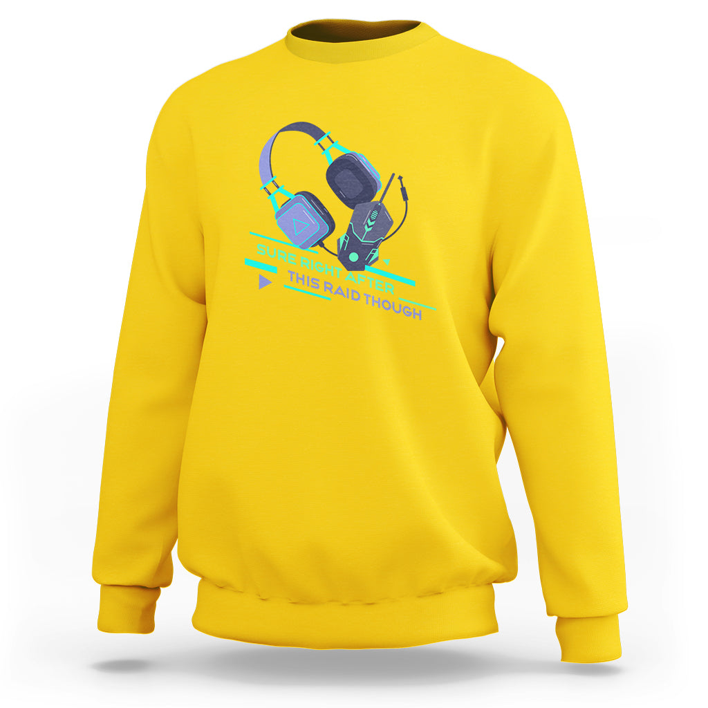 Daisy yellow crewneck sweatshirt with teal gaming controller raid graphic on front