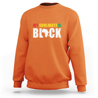 Orange sweatshirt with front graphic text "MY SOULMATE IS BLACK"
