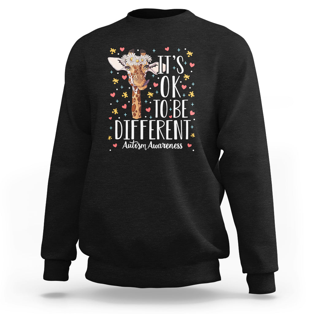 Black autism awareness sweatshirt with giraffe floral graphic: 'It's OK to be different'