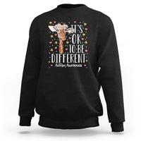 Black autism awareness sweatshirt with giraffe floral graphic: 'It's OK to be different'
