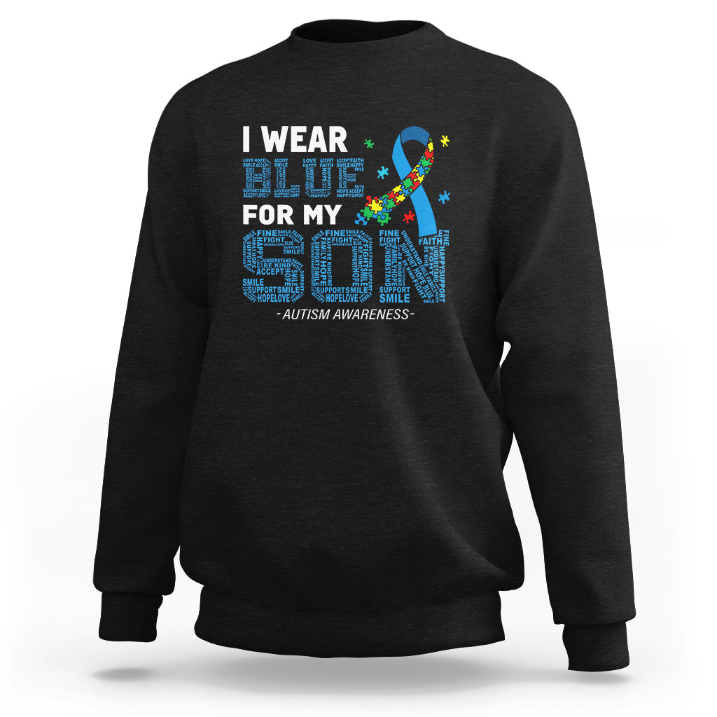 Black crewneck sweatshirt with colorful autism awareness puzzle ribbon graphic on chest