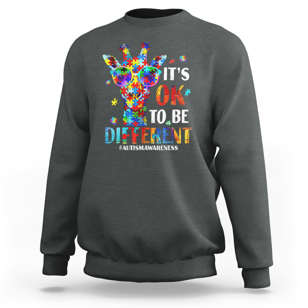 Dark heather crewneck sweatshirt with colorful giraffe autism awareness graphic on back.