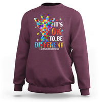 Maroon crewneck sweatshirt with colorful giraffe autism awareness graphic on back.
