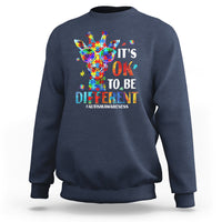 Navy crewneck sweatshirt with colorful giraffe autism awareness graphic on back.