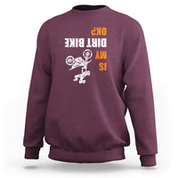Maroon biker sweatshirt with upside-down dirt bike graphic and bold text print