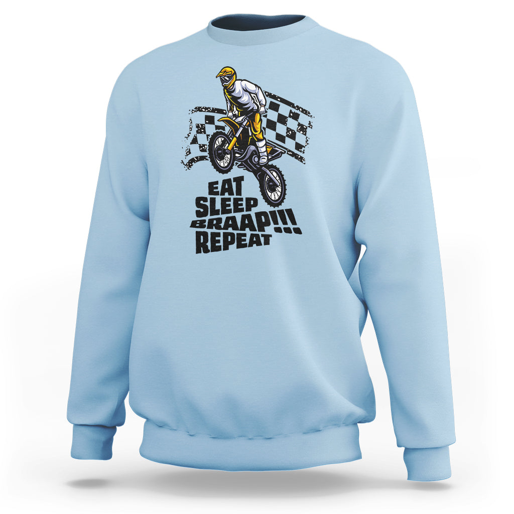 Light blue dirtbike sweatshirt with front rider graphic and “EAT SLEEP BRAAP REPEAT” text.