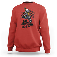 Red dirtbike sweatshirt with front rider graphic and “EAT SLEEP BRAAP REPEAT” text.