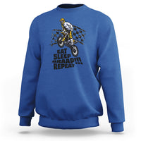 Royal blue dirtbike sweatshirt with front rider graphic and “EAT SLEEP BRAAP REPEAT” text.