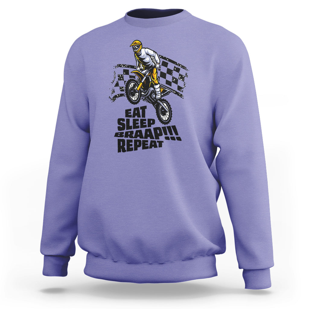 Violet dirtbike sweatshirt with front rider graphic and “EAT SLEEP BRAAP REPEAT” text.