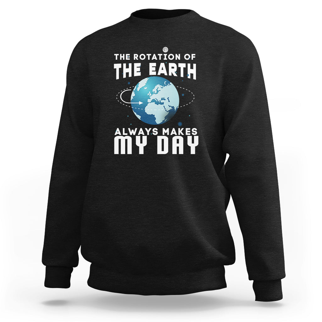 Black sweatshirt with large “THE EARTH” graphic and “ALWAYS MAKES MY DAY” text