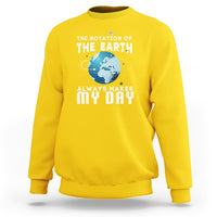 Daisy yellow sweatshirt with “THE EARTH” globe graphic and “ALWAYS MAKES MY DAY” lettering
