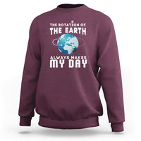 Maroon sweatshirt with “THE EARTH” globe graphic and “ALWAYS MAKES MY DAY” lettering