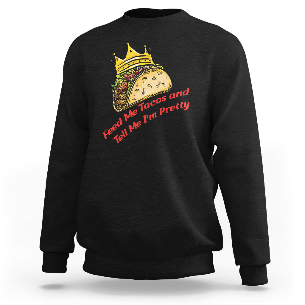 Black crewneck sweatshirt with taco character graphic and red text