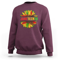 Maroon crewneck sweatshirt with colorful Juneteenth sunflower graphic