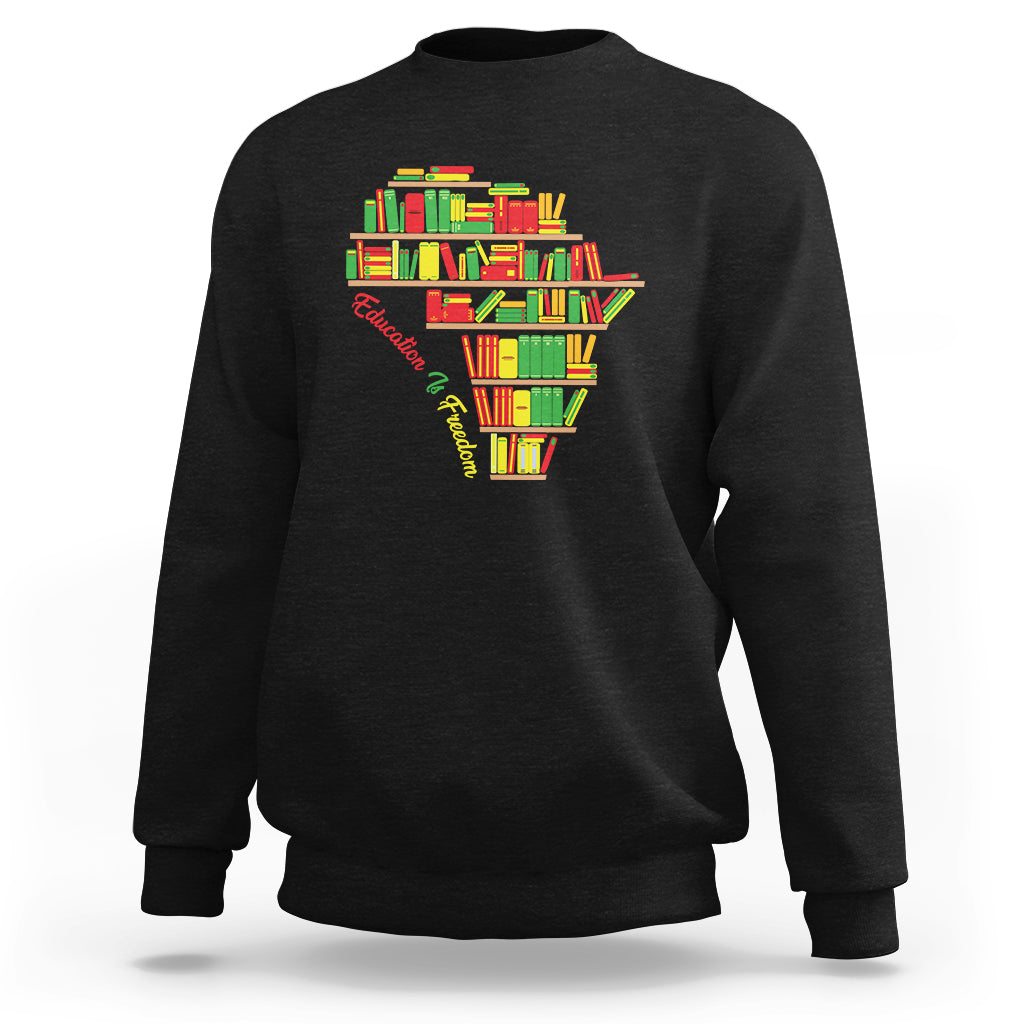 Black crewneck sweatshirt with colorful books heart graphic at the chest