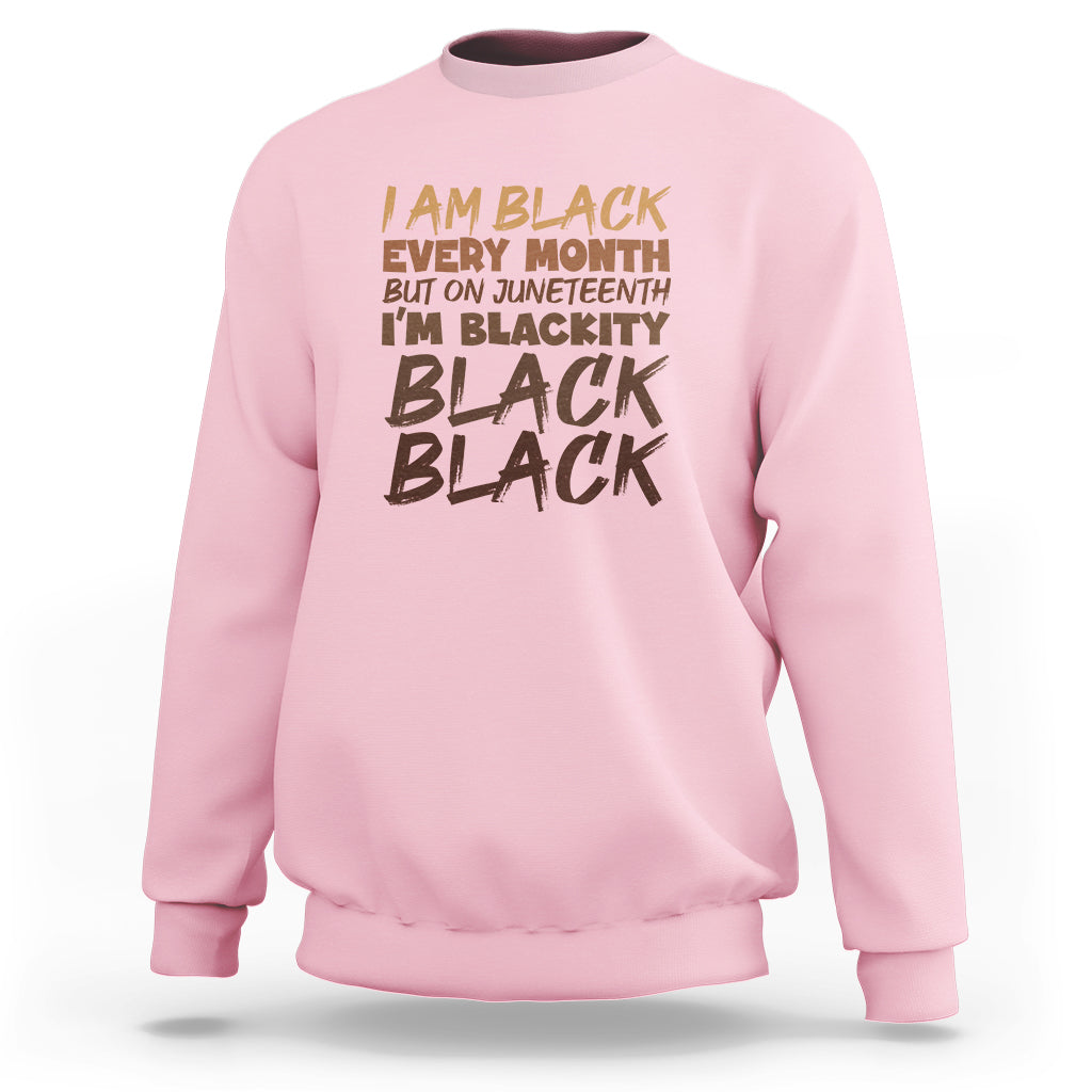 Light pink crewneck sweatshirt with front graphic text print and ribbed cuffs and hem.
