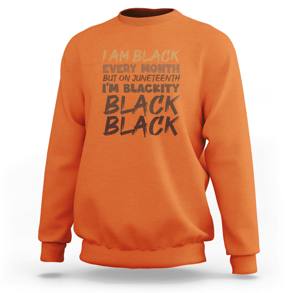 Orange crewneck sweatshirt with front graphic text print and ribbed cuffs and hem.