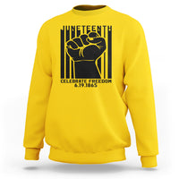 Daisy yellow crewneck sweatshirt with black Juneteenth-style fist graphic on the front