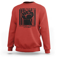 Red crewneck sweatshirt with black Juneteenth-style fist graphic on the front