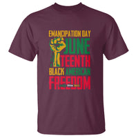 Maroon Juneteenth T-shirt with front graphic text: Emancipation Day and Freedom